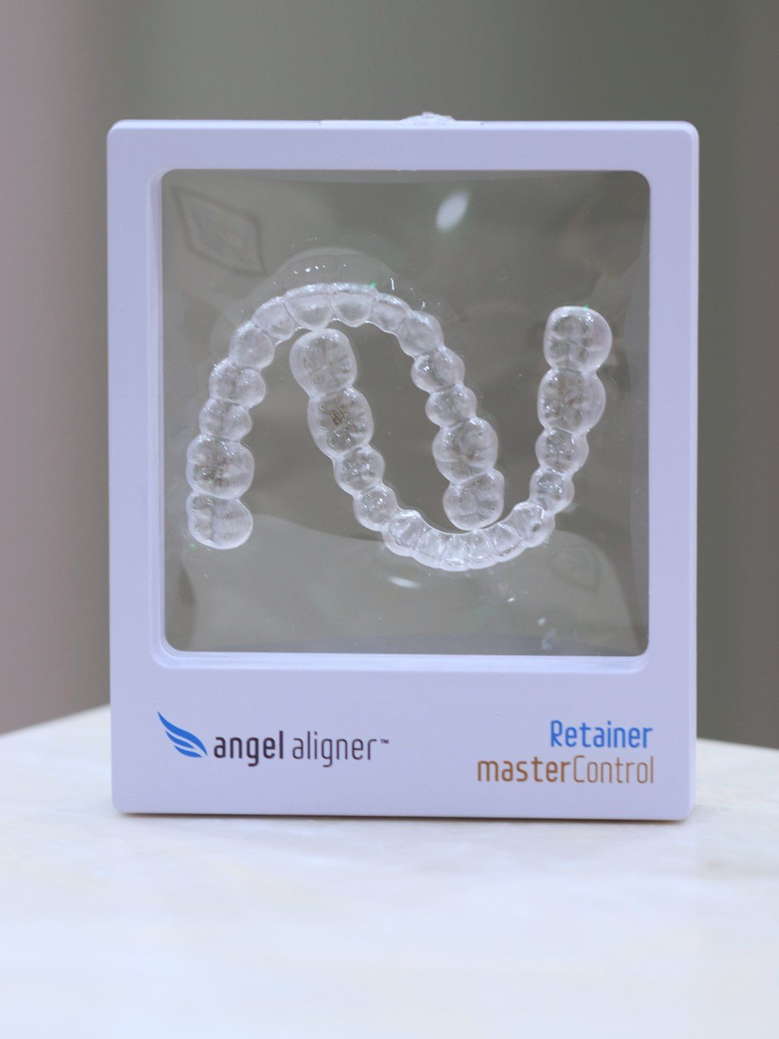 Clear retainer in a display case